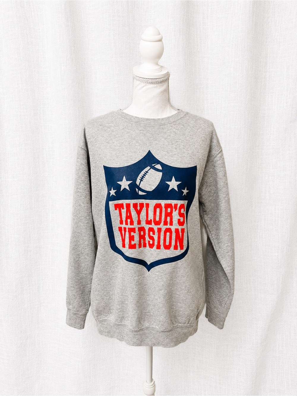 Grey Crewneck Sweatshirt with Navy Shield and Red Graphic